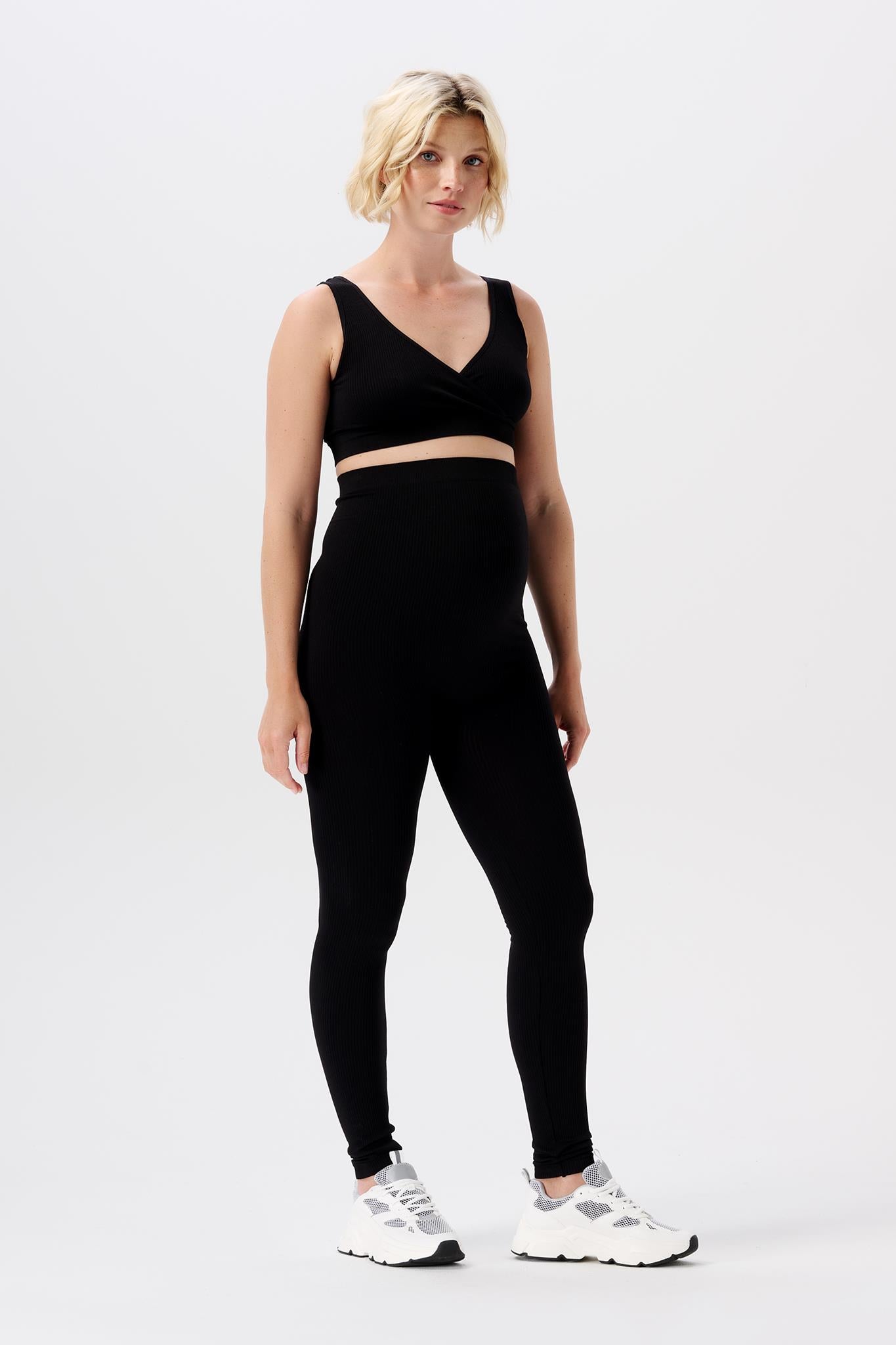 Noppies nahtlose Umstandsleggings in schwarz gezeigt von sportlichem Model. Zu kaufen oder mieten bei Mutterkleid