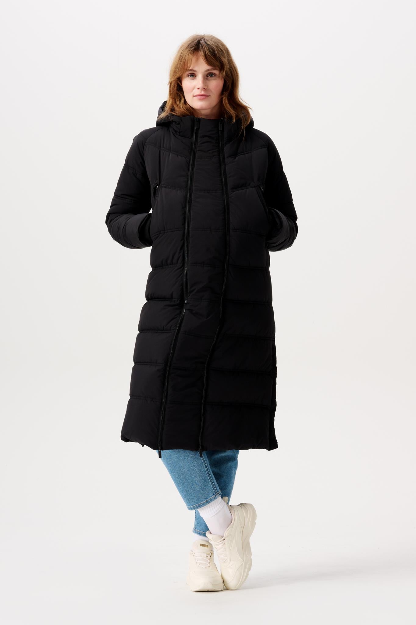 Langer Wintermantel von Noppies, hier gezeigt in Frontaleransicht durch das Model, für die Schwangerschaft und mit Trageeinsatz bei Mutterkleid kaufen oder mieten 